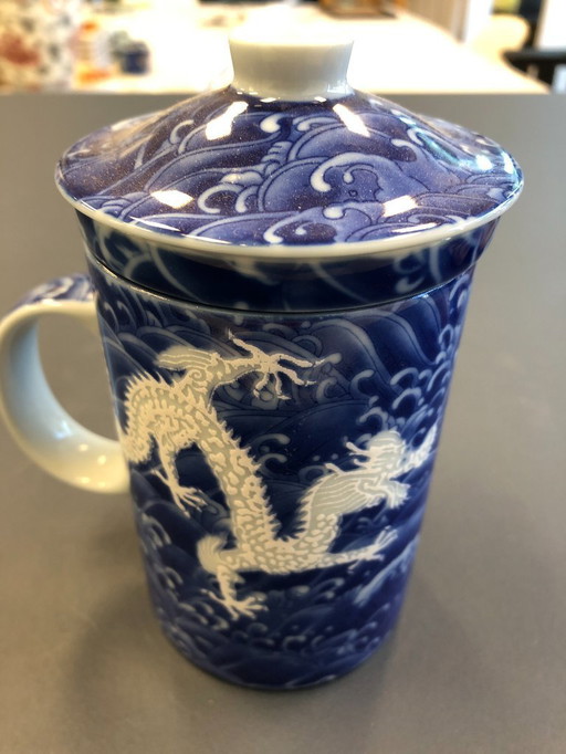 Chinese tea cup with filter and lid