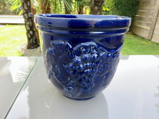 Wall-mounted flower pot, grape motif, in blue glazed ceramic, 1970s