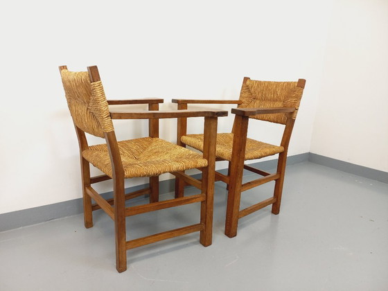 Image 1 of Suite van 2 vintage Brutalistische fauteuils in eiken en stro uit de jaren 60