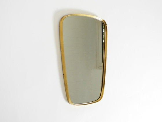 Image 1 of A pair of rare original Mid Century Modern "Münchener Zierspiegel" wall mirrors with heavy brass frames