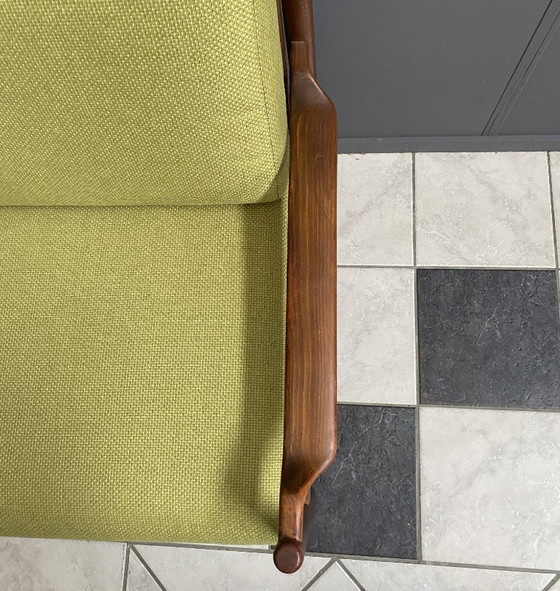 Image 1 of Gele stoffen en houten relaxstoel uit de jaren 60.