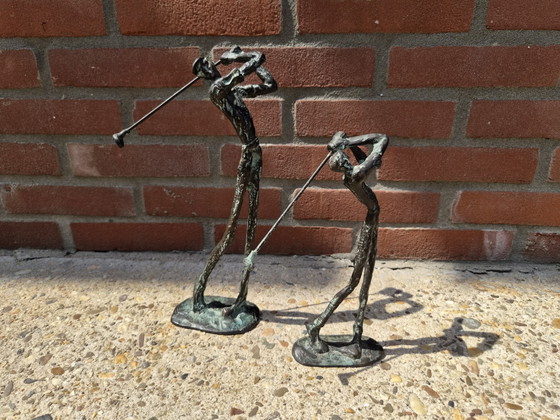 Image 1 of 2 real bronze golfers