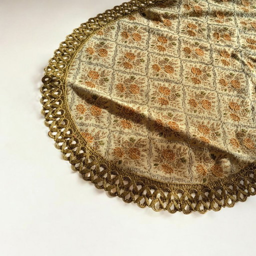 Vintage tablecloth/placecloth with floral pattern and gold-colored trim