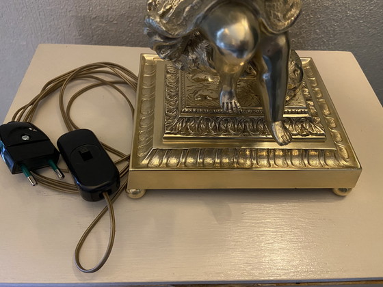 Image 1 of Bronze table lamp depicting a cherub playing the guitar