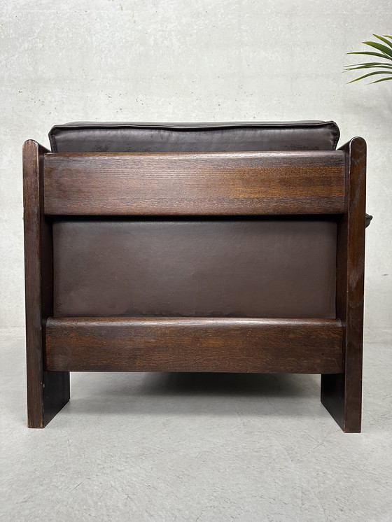Image 1 of Vintage Leolux bruinkleurige lederen/eiken ‘Lounge chair and ottoman’ van Harry de Groot - 1970