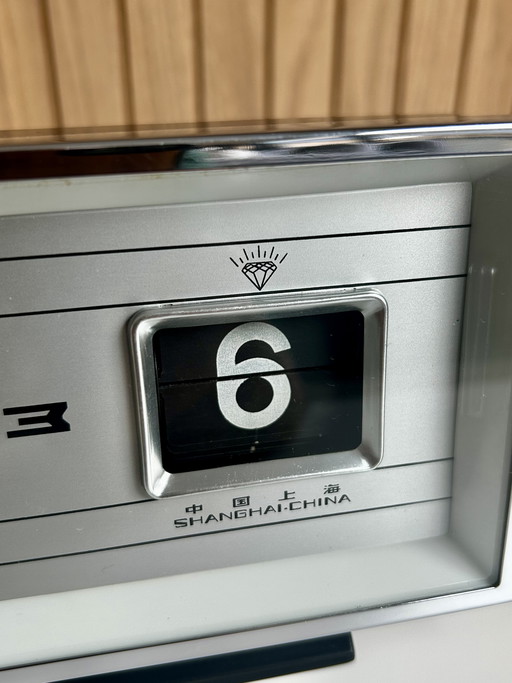 Vintage desk clock with flip date, made in Shanghai China.