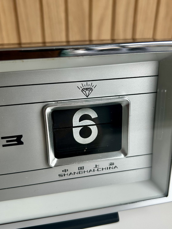 Image 1 of Vintage desk clock with flip date, made in Shanghai China.