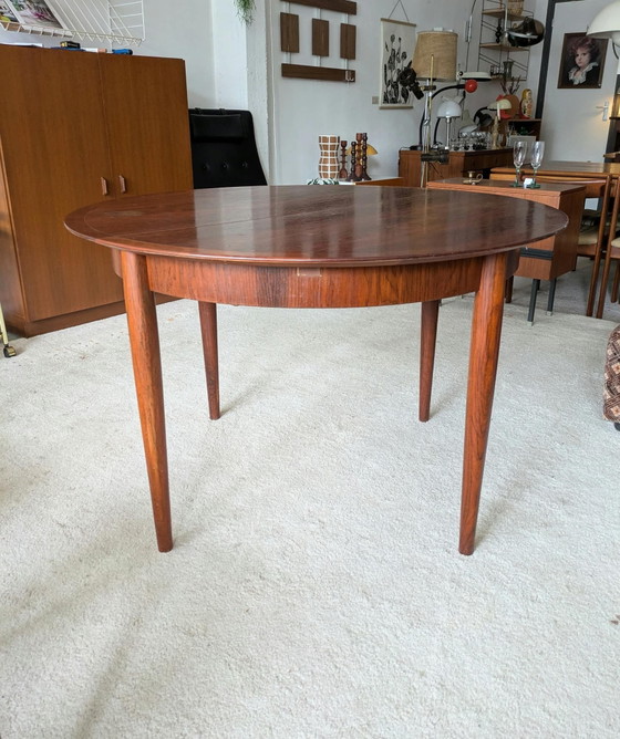 Vintage rosewood round extendable dining table (photo 3 of 11)
