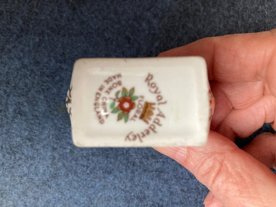 Image 1 of Porcelain napkin ring with applied flowers