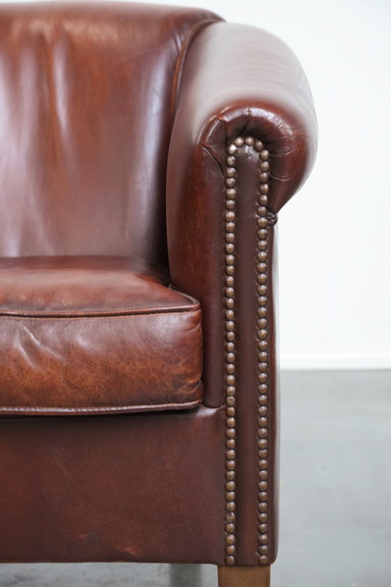 Image 1 of Vintage schapenleren clubfauteuil met siernagels