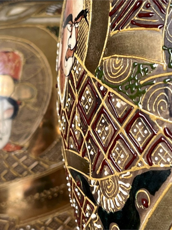 Image 1 of Pair of early 20th-century Satsuma Japanese vases – polychrome and gilt decoration with figures – workshop signature – 31 cm