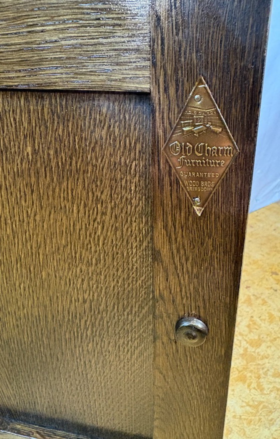 Image 1 of Vintage Old Charm Furniture Canted Side Cabinet by Wood Brothers (Circa 1970)  A charming and beautifully crafted vintage canted