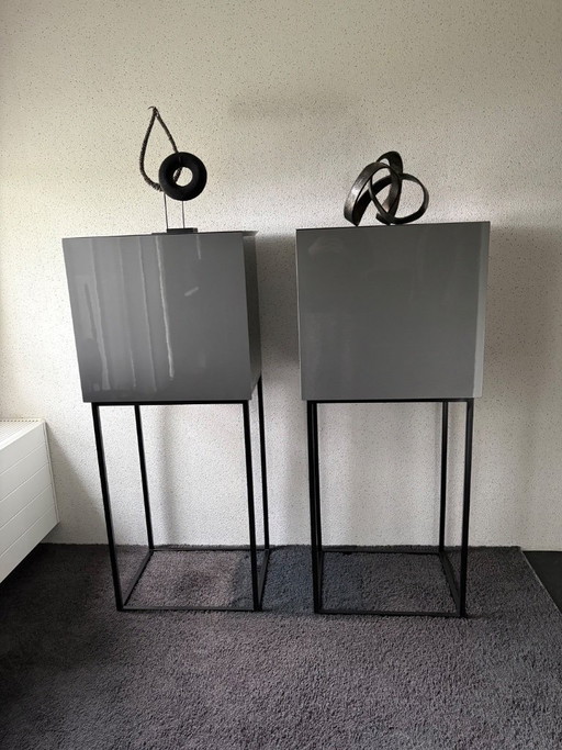 2 grey cabinets on a steel frame