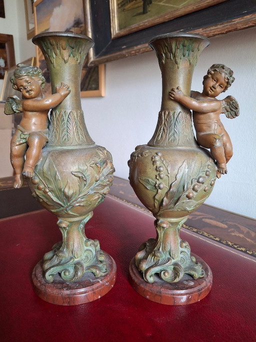 Pair of Art Nouveau spelter vases, circa 1900, with cherubs and a double patina