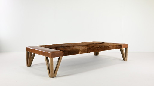 Lionel Jadot, Important Daybed in Cowhide, Leather and Oak. C.2010