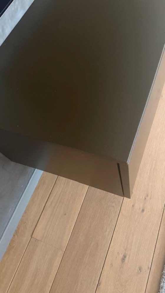 Image 1 of brown wall cupboard (possibly for under TV) with 3 folding doors