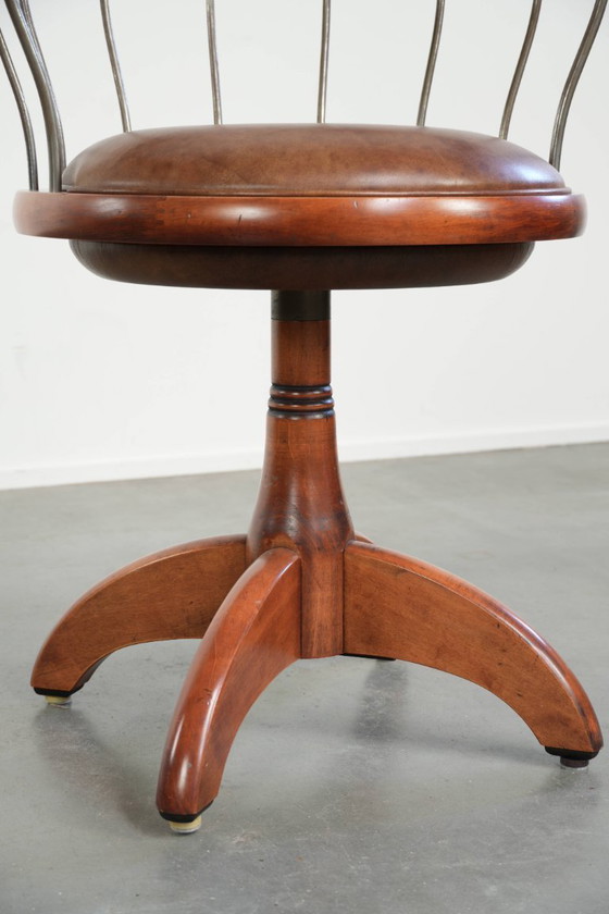 Image 1 of Draaibare Schuitema stoel/ bijzetstoel/ bureaustoel met een cognac kleurige rundleren zitting