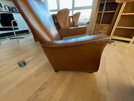 Image 1 of Mid 1900 lederen fauteuils
