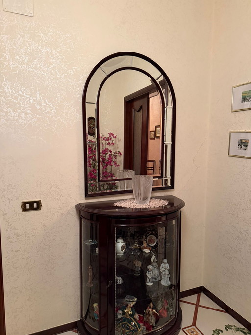 Consola semicircular y espejo de los años 70.