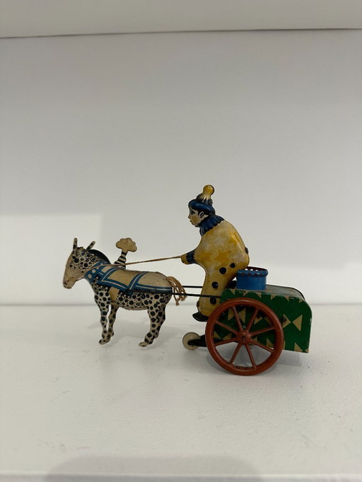 Jouet ancien en tôle lithographiée – Char à âne conduit par un clown