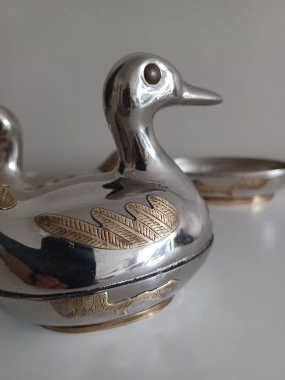 Image 1 of Vintage koppel tinnen eendjes met koper. Opbergdoosjes.