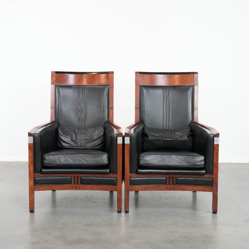 2 fauteuils Art déco en cuir de vachette noir avec dossier haut, de la marque Schuitema