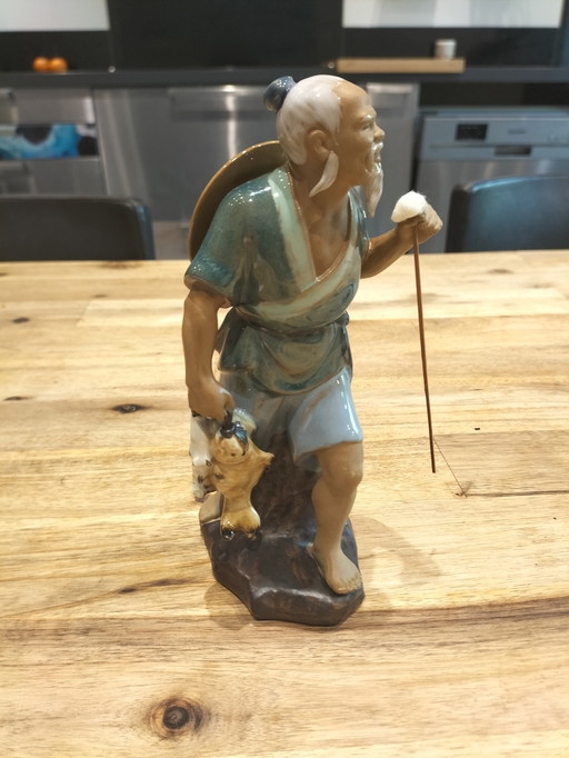 Asian statuette in glazed stoneware