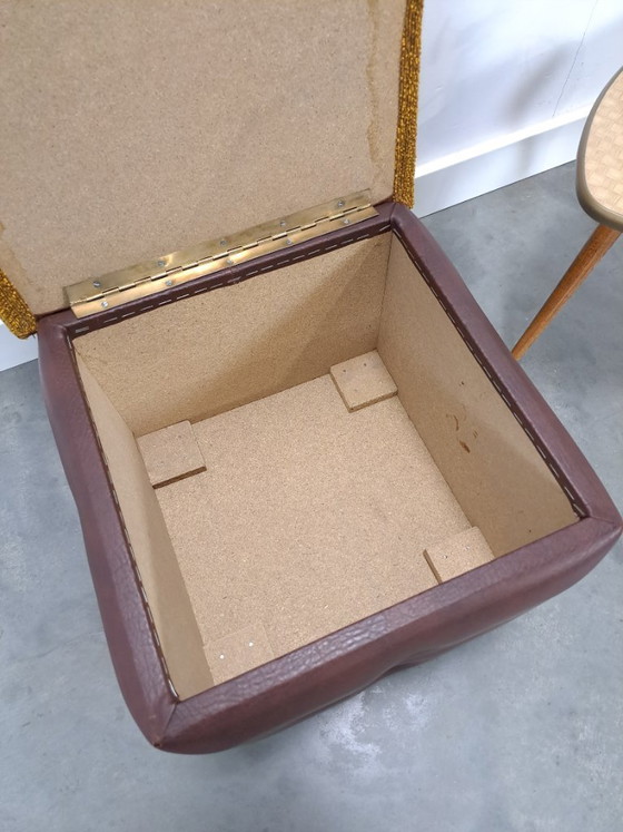 Image 1 of Ottoman with lid on chrome wheels