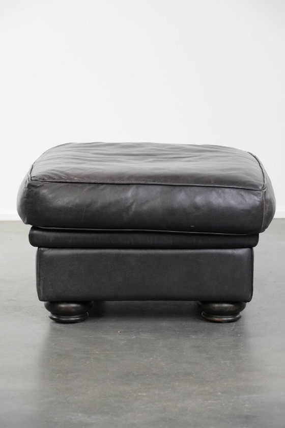 Image 1 of Set consisting of a black Chesterfield sofa, armchair and footstool made of cowhide