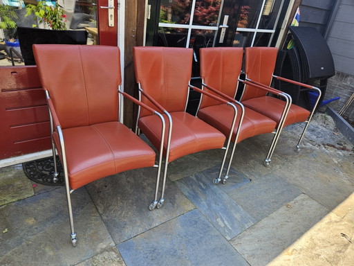 4 red leather dining chairs on wheels, brand Bert Plantagie