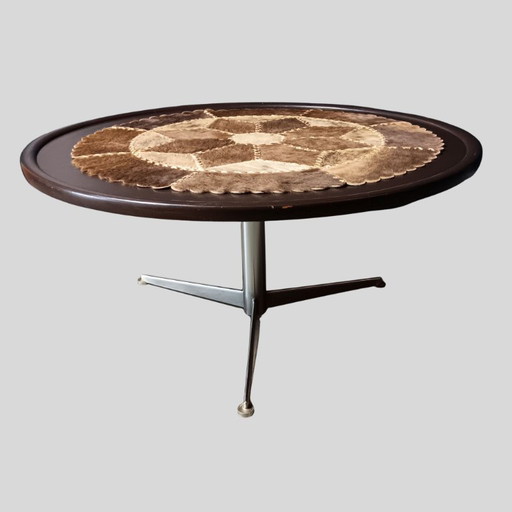 Vintage round coffee table with loose patchwork of cowhide