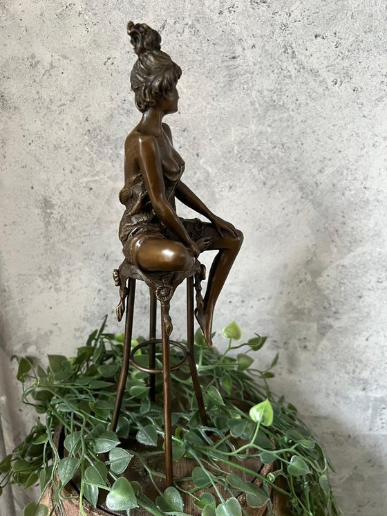 Image 1 of Bronze statue of a woman on a stool