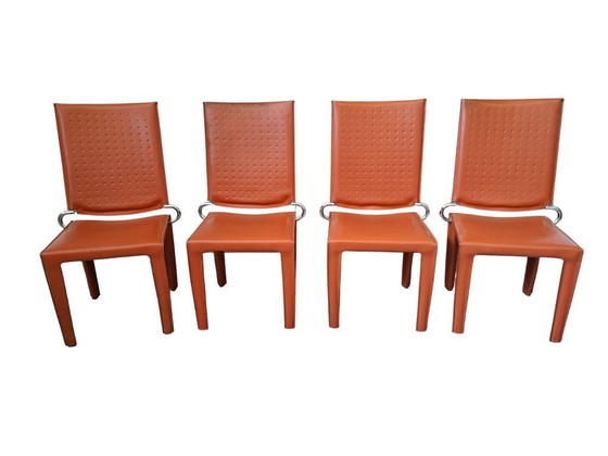 Image 1 of Set van 4 designstoelen in oranje leer en vintage ijzer.