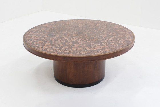 Image 1 of Vintage brutalist round coffee table in copper and wood from the 1970s