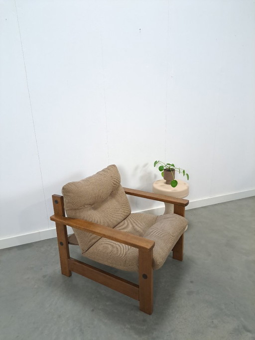 Bruin grijze fauteuil met eikenhouten frame