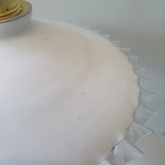 Image 1 of 2 vintage hanglampen van wit opaline glas met een transparante sierrand.