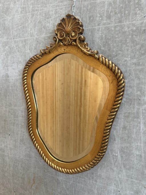 Vintage-Spiegel mit goldverziertem Wappen und facettiertem Glas