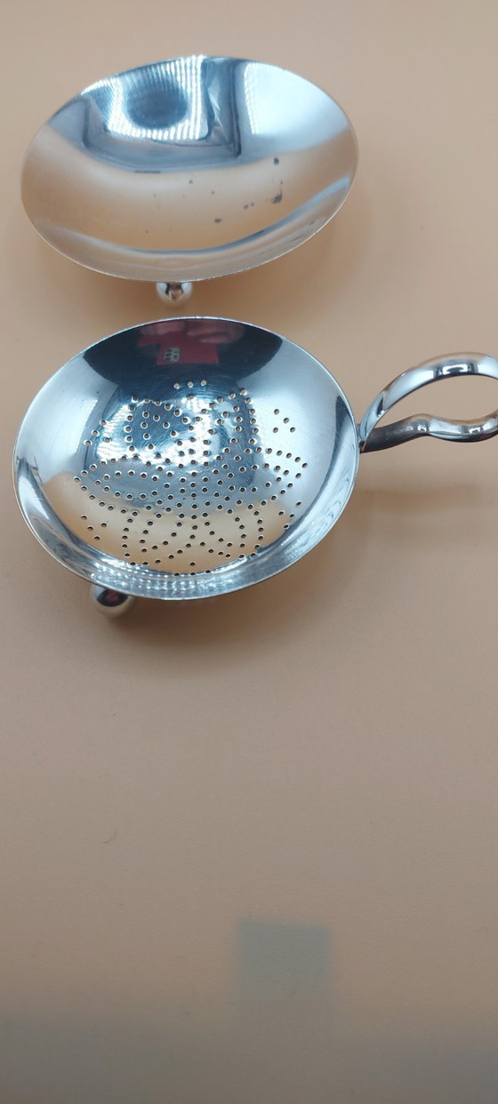 Image 1 of Lot of silver-plated items including candlestick, small bowl, tea strainer