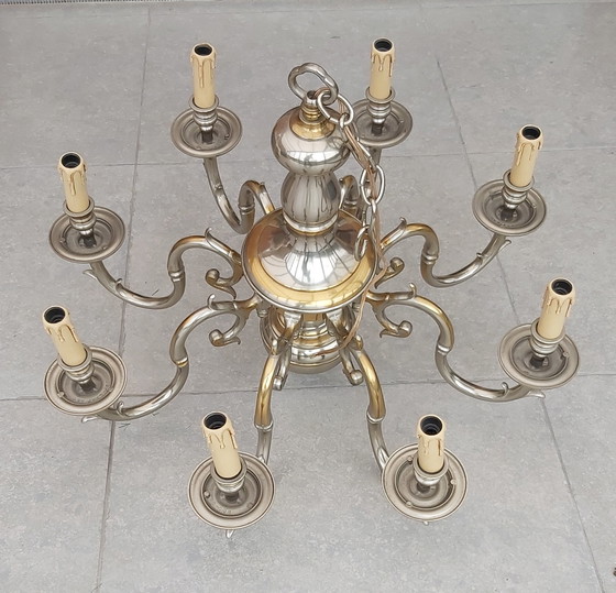 Image 1 of beautiful lusters bronze with silver
patinated.
MOD DEP LAMP ART
12 arms and 8 arms.