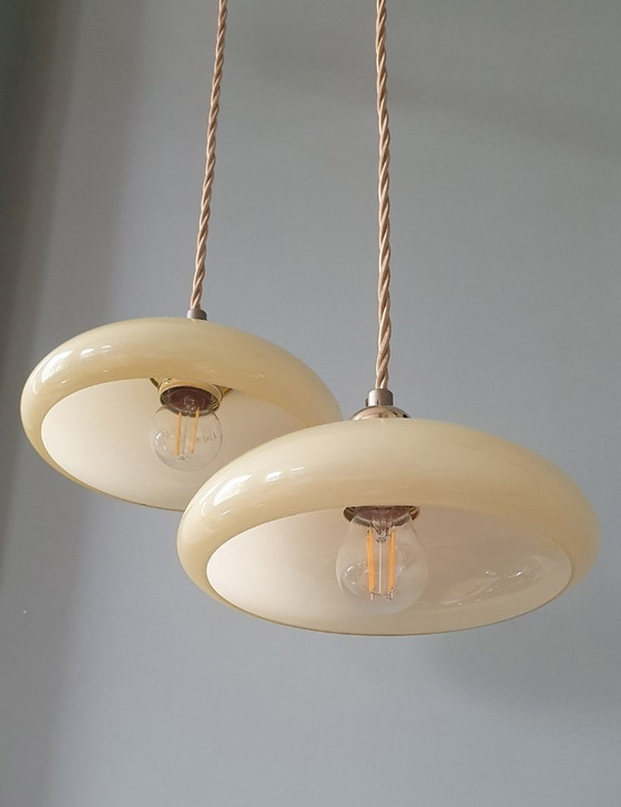 Image 1 of Vintage French pendant lamp set - of pastel yellow opaline glass.