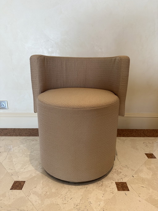 Small round upholstered armchair 