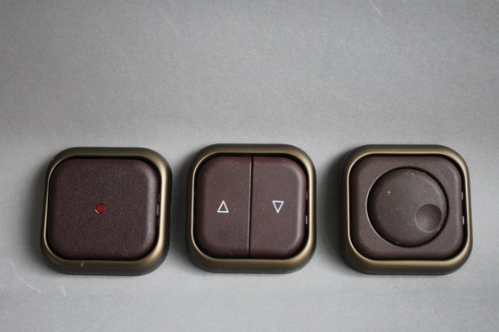 Image 1 of Large collection of vintage brown sockets and light switches with antique gold frames, 1960s/70s