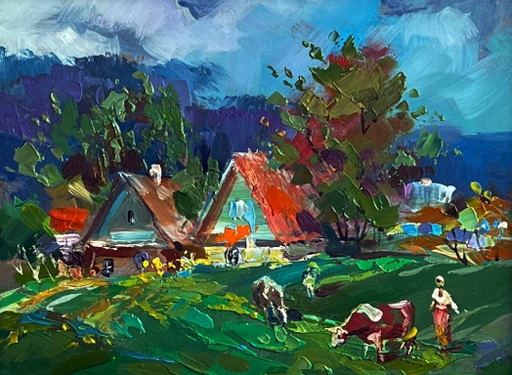 Des vaches paissent dans le village