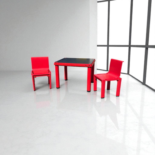 MASAYUKI MATSUKAZE & CENTROKAPPA DESIGN TEAM for Kartell table and two red chairs for children Sistema Scuola