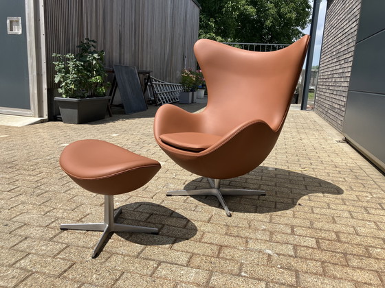 Image 1 of 2x Fritz Hansen Egg Chair + Ottoman en cuir Cognac NEUF !!!