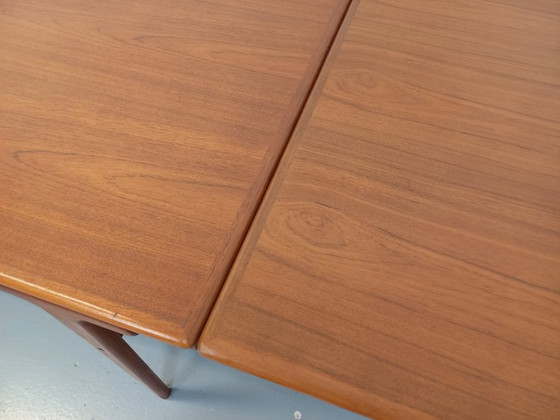 Image 1 of Vintage Scandinavian rectangular dining table by Ejvind A. Johansson from the 50s and 60s in teak with integrated extensions