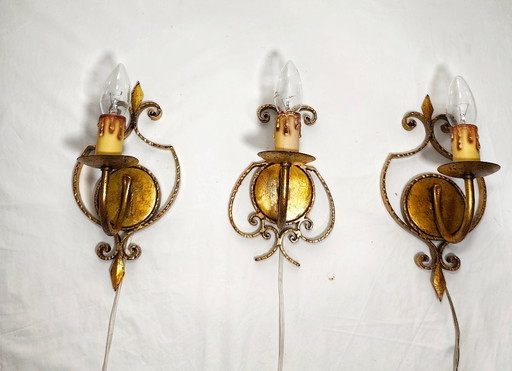 Wrought iron and gold leaf wall lights. Spain, 1960s.