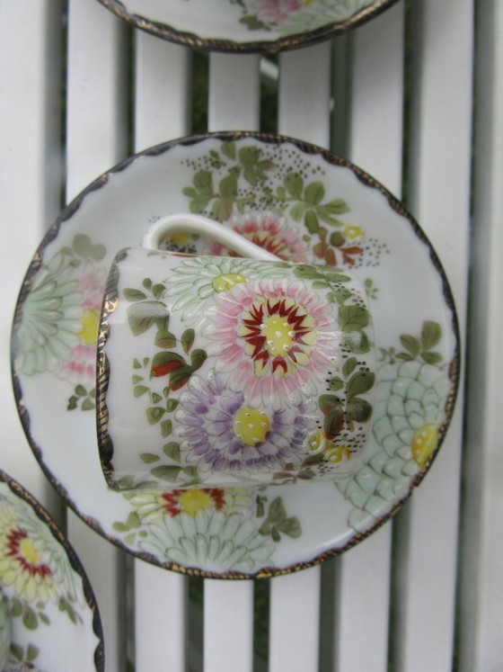 Image 1 of Vintage 4 Asian miniature cups and saucers with gold tone rims new condition