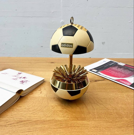 Image 1 of Vintage Adidas cigarette dispenser from the 1970s