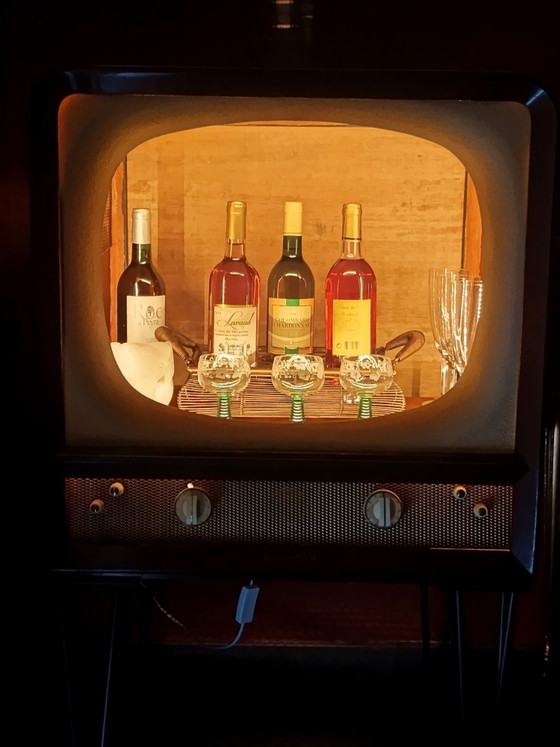 Unique vintage television creatively converted into an illuminated liquor cabinet., Radiobell, Metal, Plastic (photo 4 of 12)